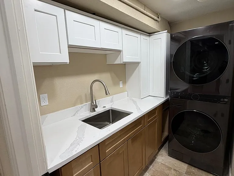 Shared laundry room and kitchen sink area can be locked off from unit. All storage available for renter
