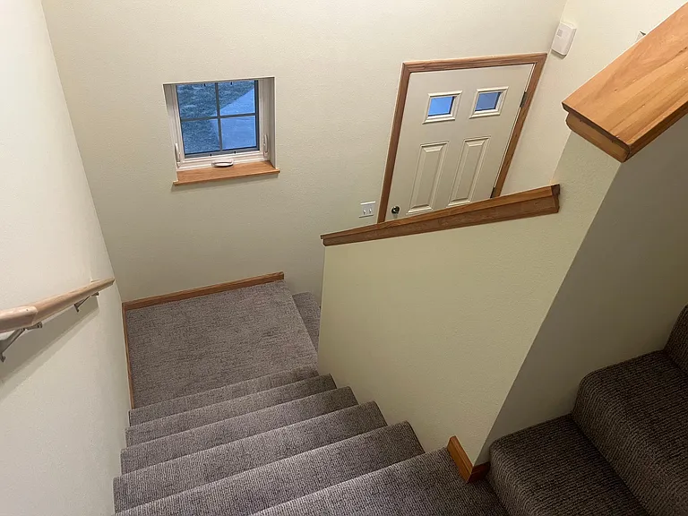 Main floor entry with stairs to upper level.