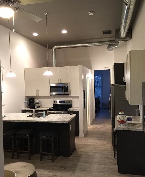 High ceilings with beautiful stainless steel appliances