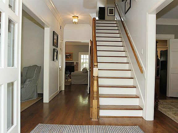 Foyer has hardwood floors. Lots of light from double glass front doors.