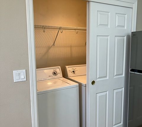 Laundry closet has washer & dryer, light, and fan and can be hidden by the bypass doors.