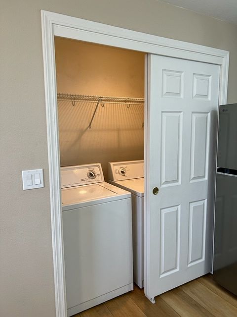 Laundry closet has washer & dryer, light, and fan and can be hidden by the bypass doors.