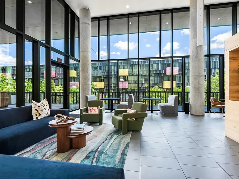 Indoor Lounge Overlooking Courtyard with Sectionals and Chair Seating