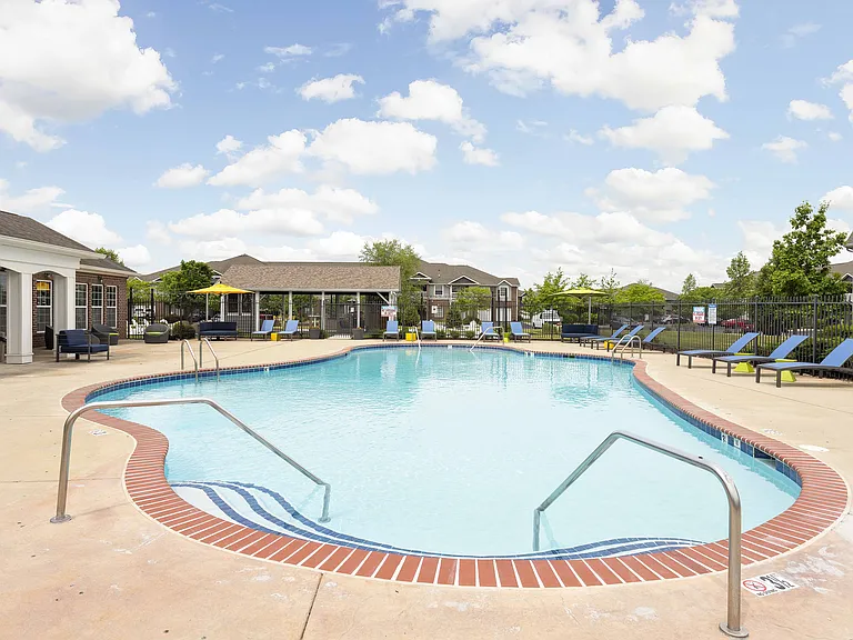 Refreshing Swimming Pool with Sundeck and Lounge Chairs