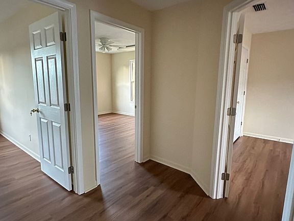 Ample hallway leading to 3 huge bedroom/ office area.