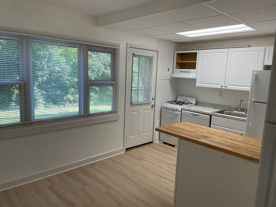 The kitchen has been remodeled with new cabinets, countertops, flooring and window blinds.