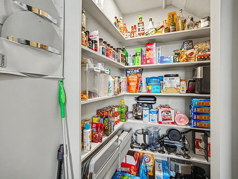 Walk-in pantry at the end of the kitchen. Renter can decide if they want to keep non perishable items like zip lock bags, spices, etc. Stores air fryer, Dyson vacuum, blender, etc.