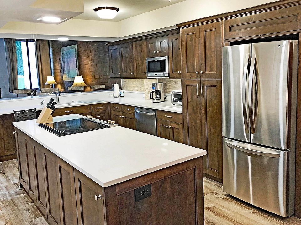 The spacious kitchen island is perfect for unpacking groceries into the pantry or refrigerator, or to place food buffet style when entertaining.