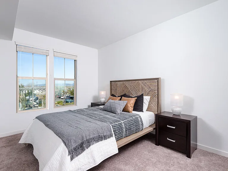 Bedrooms feature plush carpeting and horizontal blinds