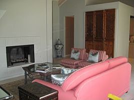 There is a cozy fireplace in the living