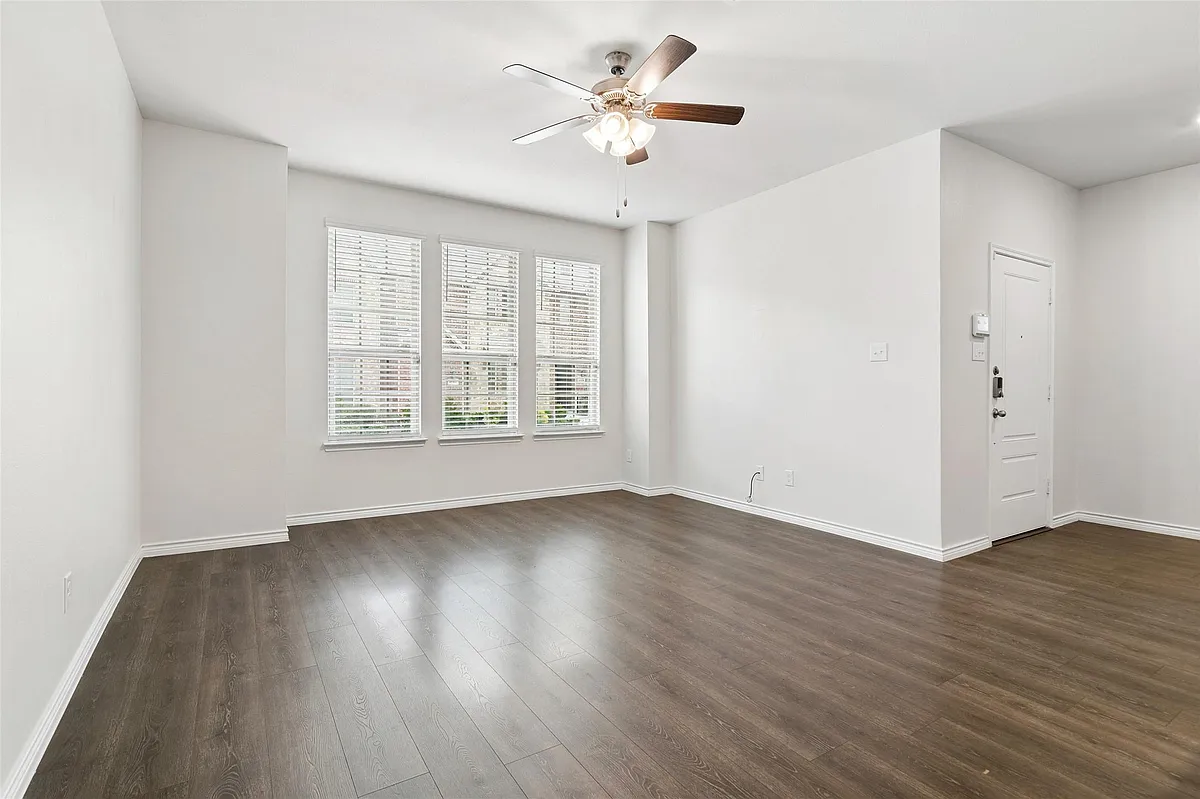 Living room with large windows letting in natural light and ceiling fan - 2041 Juniper Pass Way