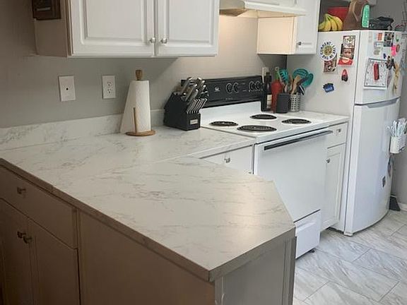 Kitchen seen from dining area (2023)