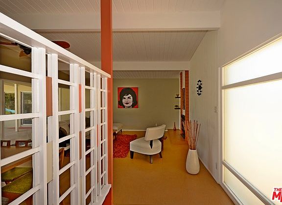 Mid Century-inspired partition at front entryway..