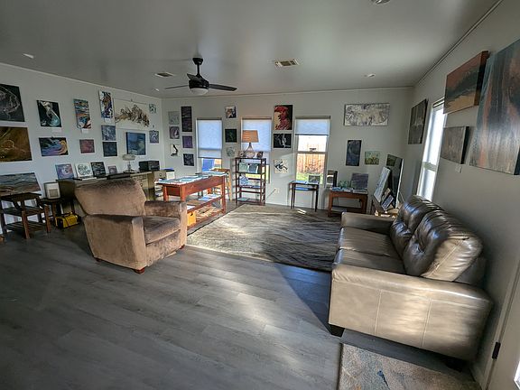 Living room. Hanging strings can be taken down or remain for your decor.