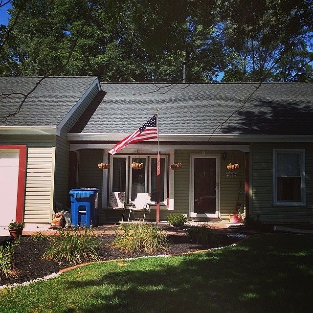 Front view, new exterior 