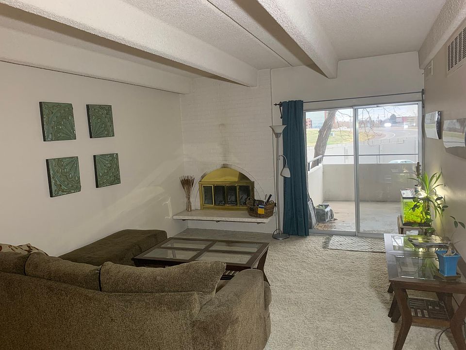 Looking straightforward into the living room at the slider, which looks out over the gardens.