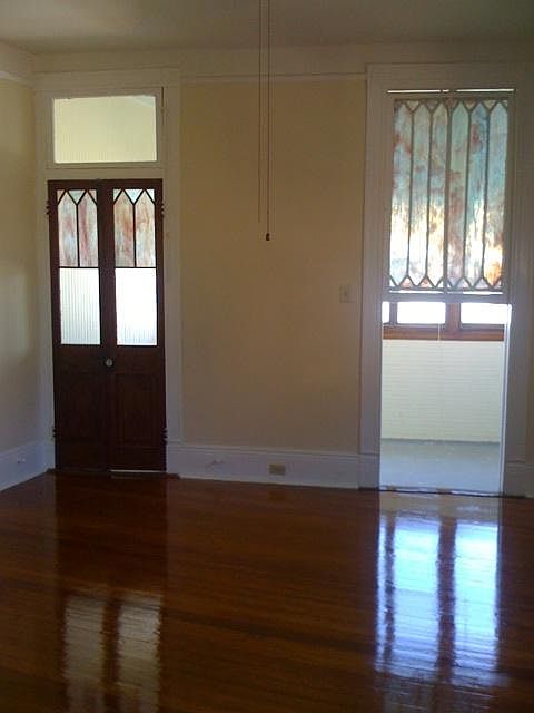 front bedroom looking out toward enclosed porch