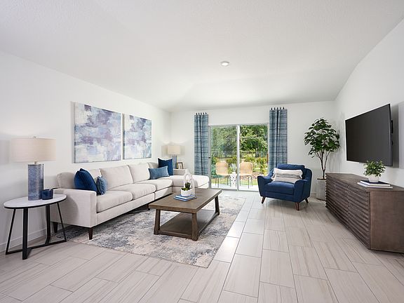The Acadia floorplan family room modeled at Kings Preserve.
