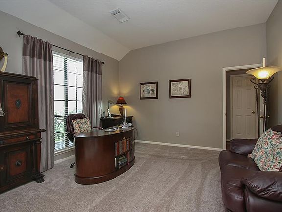 Just off the entry, is this formal living room, that makes the perfect home office!