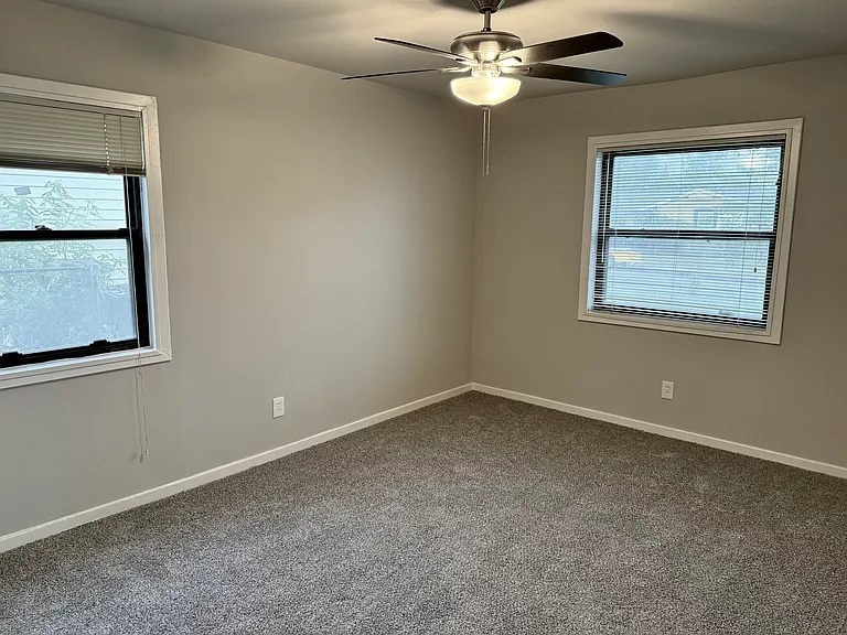 All bedrooms have new carpet and ceiling fans.