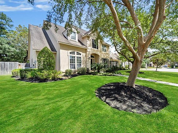 Another view of the gorgeous home with a wonderful curb appeal and inviting landscaping welcome you inside.