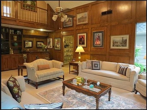 Another look at the family room showing the wet bar area and built-in shelves.