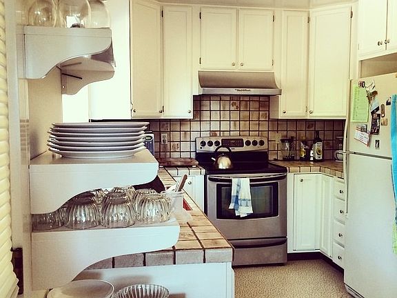 The kitchen offers plentiful cupboard and counter space.
