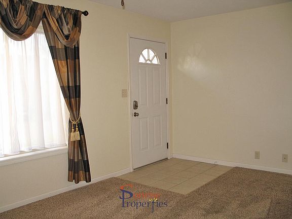 Living room and front entrance.