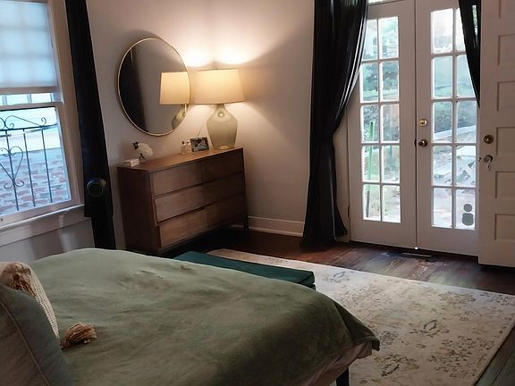 Master bedroom looking towards french doors and patio.