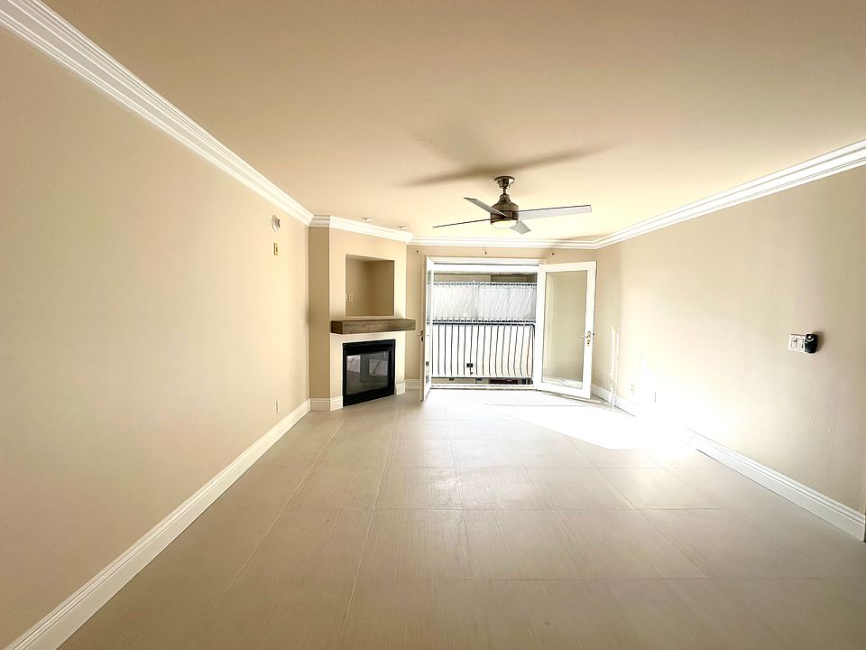 View of fireplace from kitchen