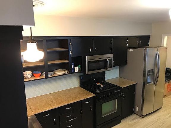Updated Kitchen with granite countertops and stainless appliances.