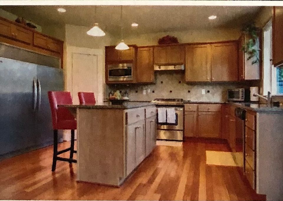 Left to Right: 
1. Large family room with fireplace and ceiling speakers 
2. Kitchen with oversized 2-door fridge, granite island and countertops, stainless steel appliances
3. Upstairs master bathroom