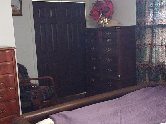 Bedroom with dressing area and walk in closet. Rented unfurnished.