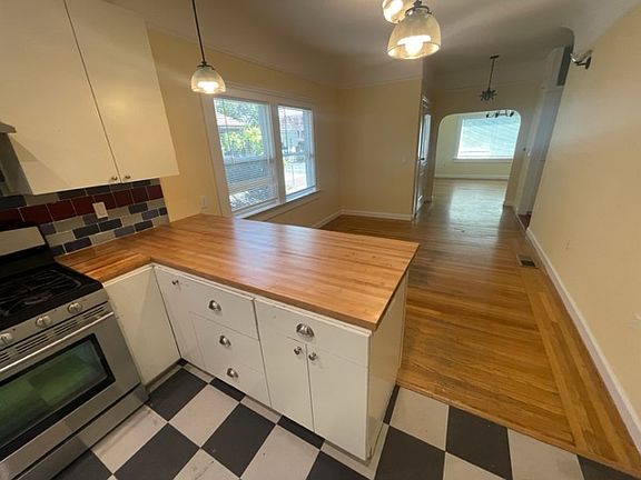 View of dining and living room from kitchen