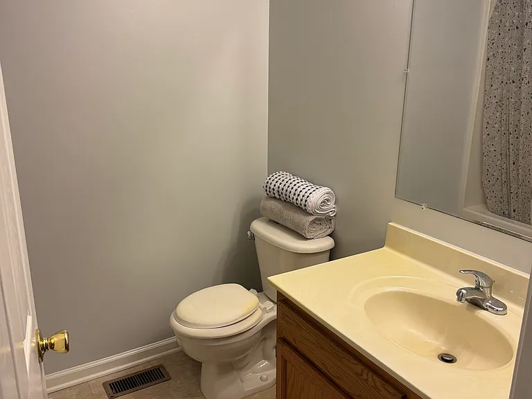 Private primary bathroom with clean finishes and a functional layout.