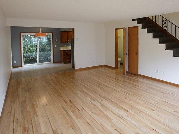 Giant living room with hardwood floors
