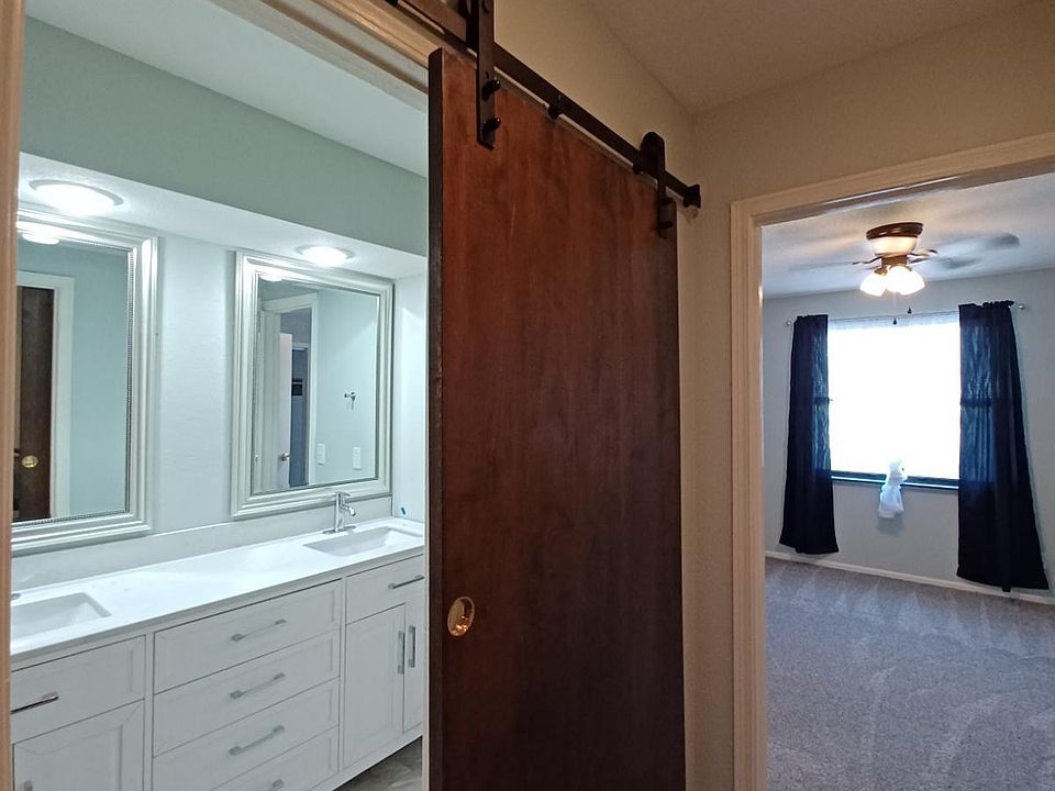 upstairs Luxury bathroom, vanity, toilet, shower/ tub combo, flooring , carpet and toilet