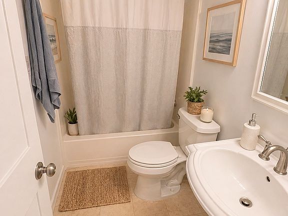 Top floor full bath shared between bedroom 2 and 3