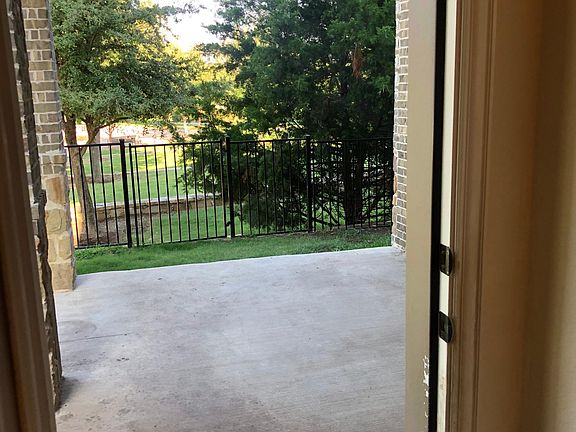 Backyard Patio with yard and beautiful views of community fountain.
