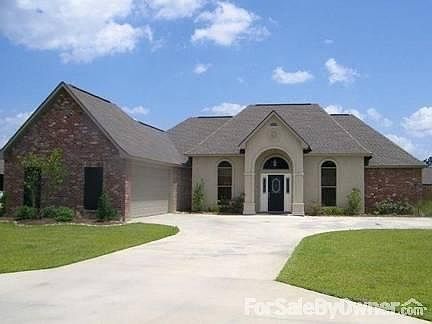Front View
						:
						Custom Fleur De Lis above front porch.