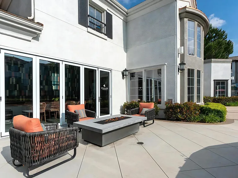 Outdoor Patio with Fire Table and Woven Lounge Seating