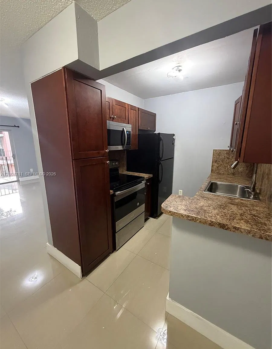 Spanish Trace Condo — Photo 3
