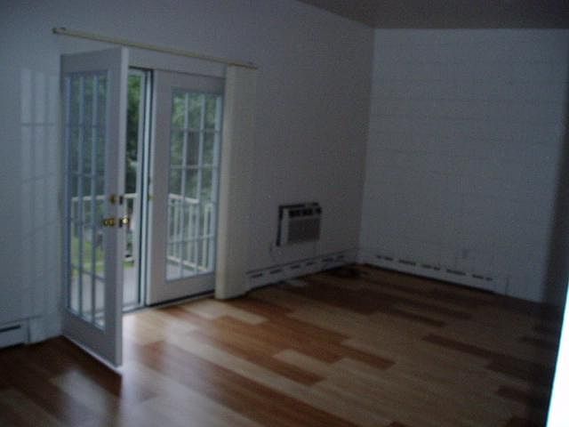 12 x 24 LIVING ROOM/DINING ROOM WITH FRENCH DOORS TO A VERY SUNNY BALCONY. WALL AC UNIT