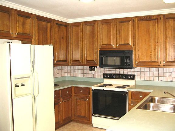 Large Kitchen with Stained Cabinets.