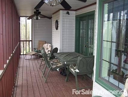 Deck off the living room
						:
						Screened-in deck with ceiling fan