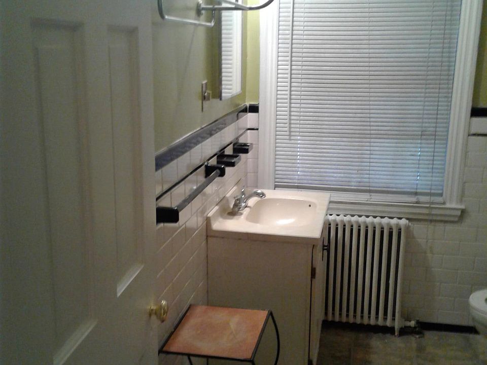 full size bathroom which is next to large bedroom