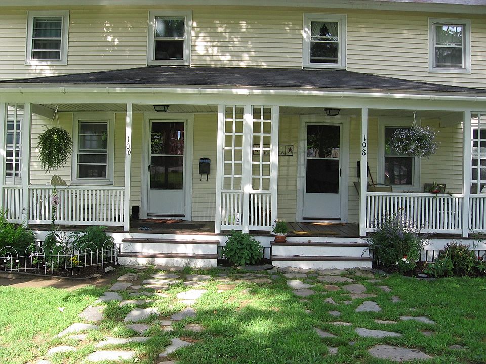 front of home, unit is on left