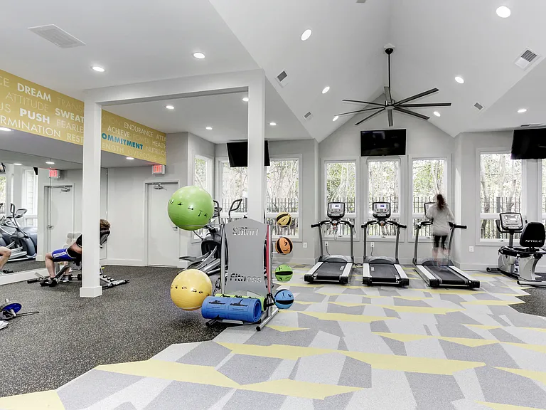 24-Hour Fitness Center with Cardio Machines, Free Weights, and Yoga Area