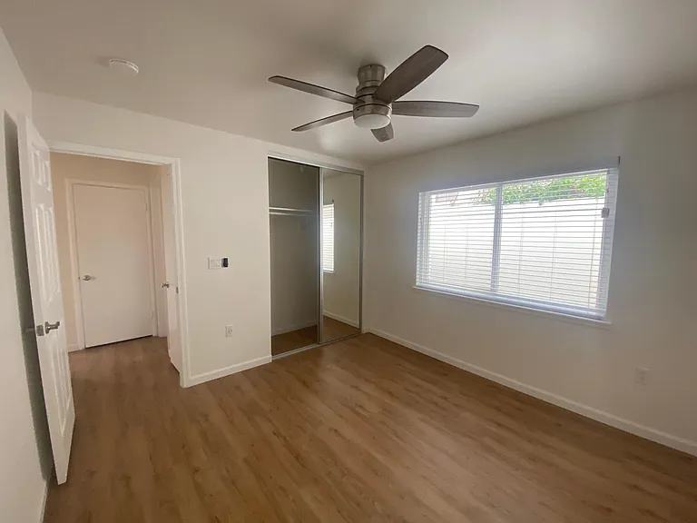 Bedroom#2 with sliding/mirror closet doors and new blinds.