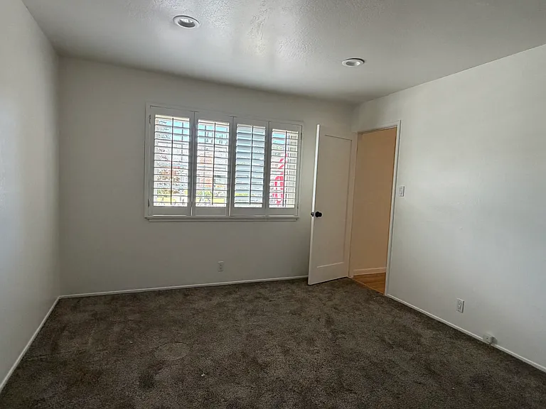 Downstairs bedroom/flex with view to front yard. This room has 2 doors--one near the front door and the other which opens into the hallway near bathroom